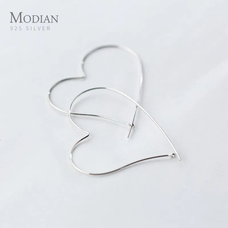 MODIAN Hot Sale Fashion Simple Charm Hearts Earrings 925 Sterling SilvSPECIFICATIONSBrand Name: ModianMain Stone: NONEOrigin: Mainland ChinaCertificate: YESItem Weight: 1.47gMetals Type: silverMetal Stamp: 925,SterlingFine or Fashion: Jewelry CirclesJewelry CirclesMODIAN Hot Sale Fashion Simple Charm Hearts Earrings 925 Sterling Silver Classic Big Hoop Earrings