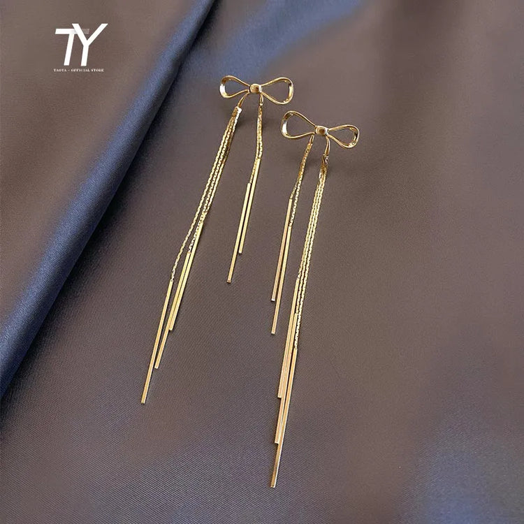 Classic Metal Bow Gold Colour Tassel Drop Earrings For Woman 2023 New SPECIFICATIONSBrand Name: TaoyaMaterial: MetalMetals Type: Copper AlloyOrigin: Mainland ChinaCN: ZhejiangItem Type: EarringsStyle: ClassicEarring Type: Drop EarringsJewelry CirclesJewelry CirclesClassic Metal Bow Gold Colour Tassel Drop Earrings