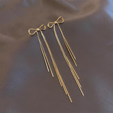 Classic Metal Bow Gold Colour Tassel Drop Earrings For Woman 2023 New SPECIFICATIONSBrand Name: TaoyaMaterial: MetalMetals Type: Copper AlloyOrigin: Mainland ChinaCN: ZhejiangItem Type: EarringsStyle: ClassicEarring Type: Drop EarringsJewelry CirclesJewelry CirclesClassic Metal Bow Gold Colour Tassel Drop Earrings